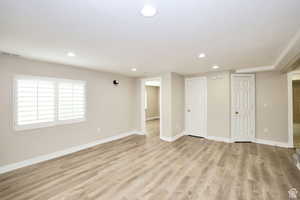 Unfurnished room with light wood-type flooring