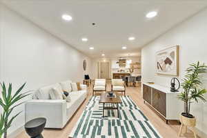 Living room with light hardwood / wood-style floors