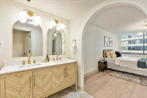 Bathroom featuring vanity and hardwood / wood-style flooring