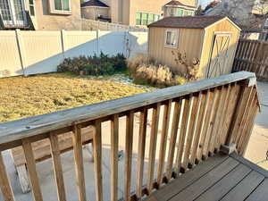 Deck featuring a storage unit