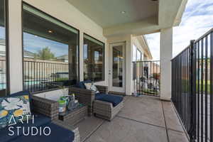 View of patio featuring a balcony