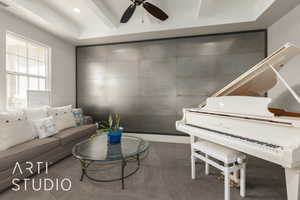 Living room featuring ceiling fan