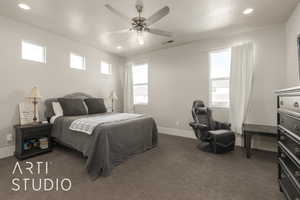 Carpeted bedroom with ceiling fan