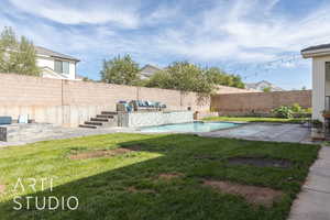 View of yard featuring a fenced in pool and a patio area