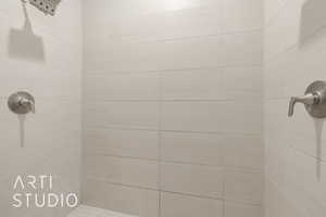 Bathroom featuring tiled shower