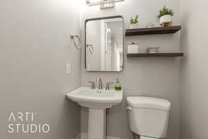 Bathroom with sink and toilet