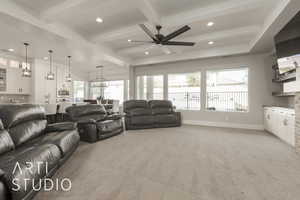 Living room featuring beam ceiling, light carpet, ceiling fan, and a healthy amount of sunlight