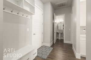 Mudroom with dark hardwood / wood-style flooring