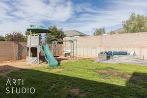 View of playground with outdoor lounge area and a lawn