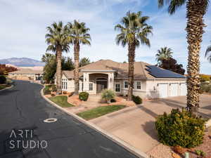 View of front facade featuring a mountain view and a garage