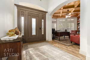 Entryway featuring a wood beam ceiling and coffered ceiling