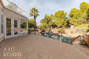 View of swimming pool featuring a patio area and french doors