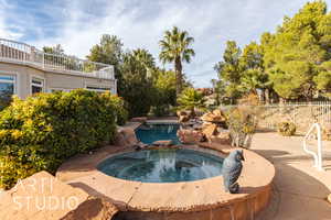 View of pool featuring an in ground hot tub