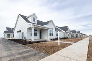 View of front of home featuring covered porch