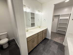 Bathroom with vanity and toilet