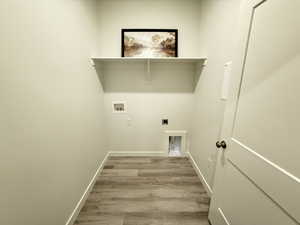 Laundry room with hookup for an electric dryer, washer hookup, and hardwood / wood-style flooring