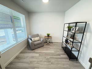 Sitting room featuring light hardwood / wood-style flooring