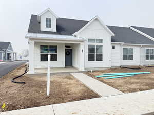 View of front facade featuring covered porch