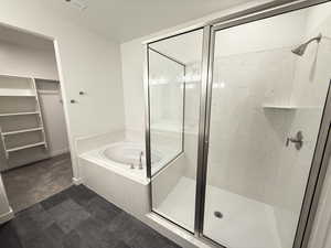 Bathroom featuring separate shower and tub