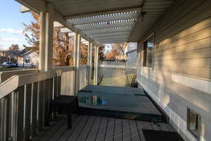 Wooden terrace featuring a pergola