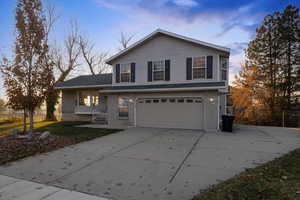 View of front property featuring a garage