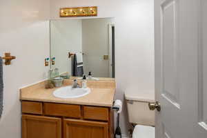 Bathroom featuring vanity and toilet