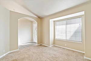 Entry room with light colored carpet