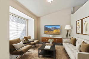 *Virtually Staged* Carpeted living room featuring vaulted ceiling