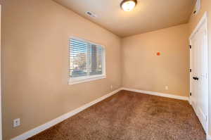 Unfurnished bedroom featuring carpet flooring