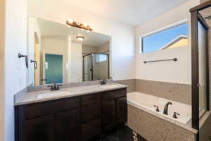 Bathroom featuring vanity, tile patterned floors, and independent shower and bath