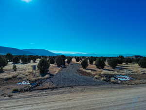 Property view of mountains with a rural view