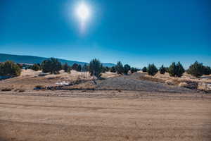 Property view of mountains featuring a rural view