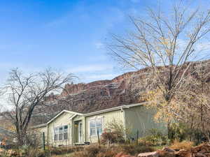 View of side of property featuring a mountain view