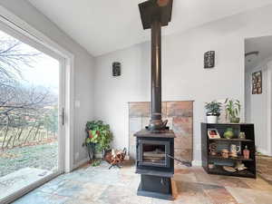 Room details featuring a wood stove