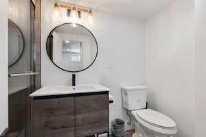 Bathroom featuring vanity and toilet