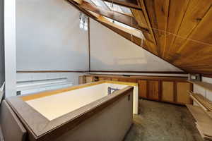 Bathroom with lofted ceiling and wood ceiling