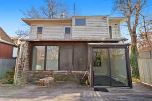 Rear view of house featuring a deck