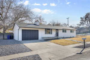 Ranch-style home featuring a garage