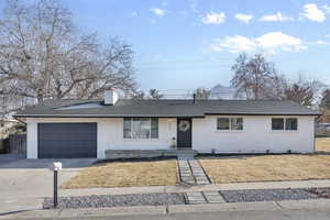 Ranch-style house featuring a garage