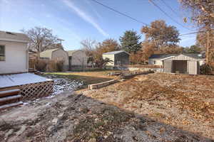 View of yard featuring a storage shed