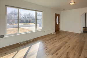 Interior space with light wood-type flooring and a wealth of natural light