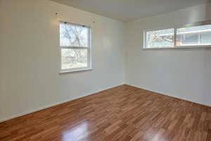 Spare room featuring hardwood / wood-style flooring