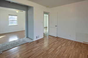 Spare room featuring ceiling fan and light hardwood / wood-style flooring