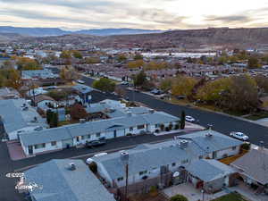 Aerial view at dusk featuring a mountain view