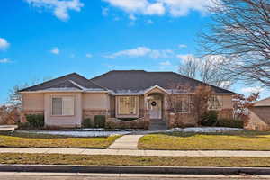 View of front of property with a front yard