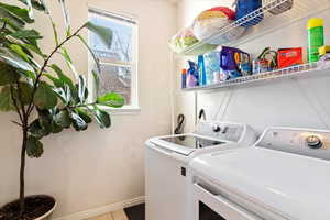 Clothes washing area with washing machine and clothes dryer