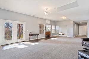 Unfurnished living room with carpet flooring