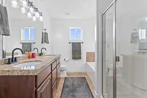 Full bathroom featuring plenty of natural light and toilet