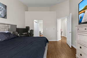 Bedroom featuring dark hardwood / wood-style flooring