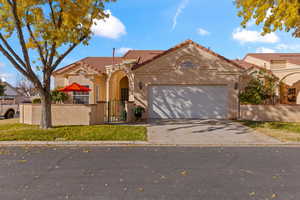 Mediterranean / spanish home featuring a garage